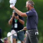 Scheffler sets 36-hole record at suspended Nelson
